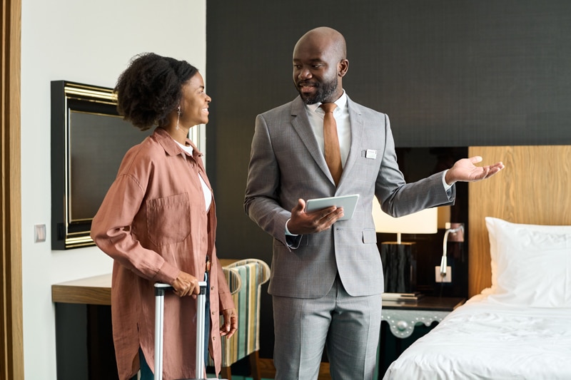 hotel manager speaking with guest