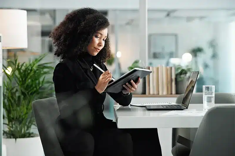 lady looking at tablet in office