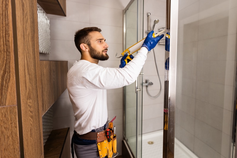 man working on shower