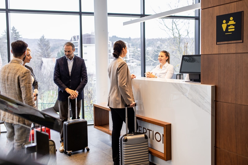 multiple guests checking in to hotel