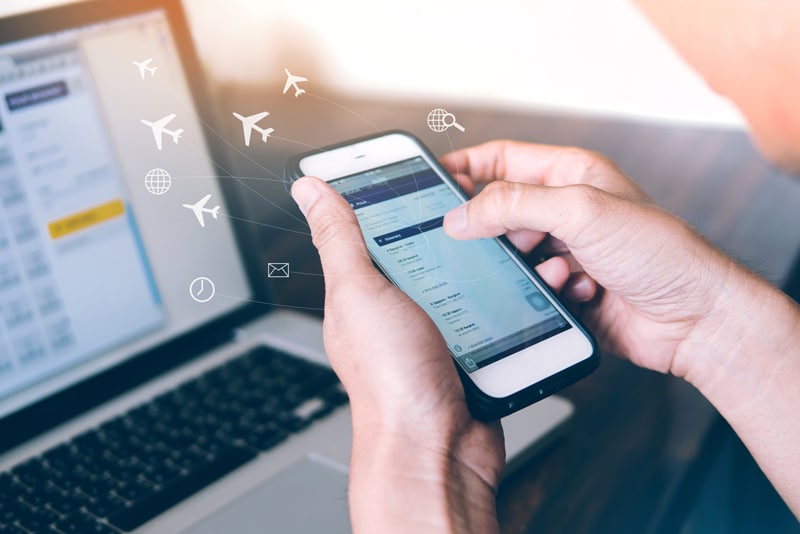 person booking a vacation on a phone