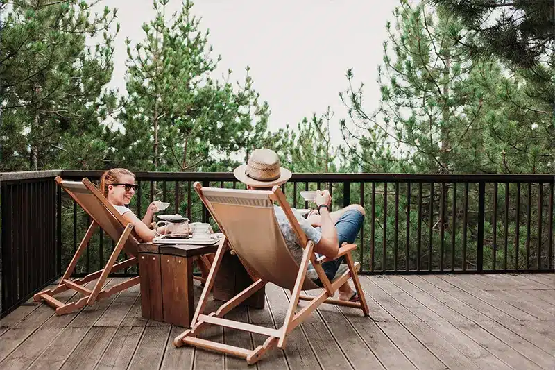 two people sitting on deck